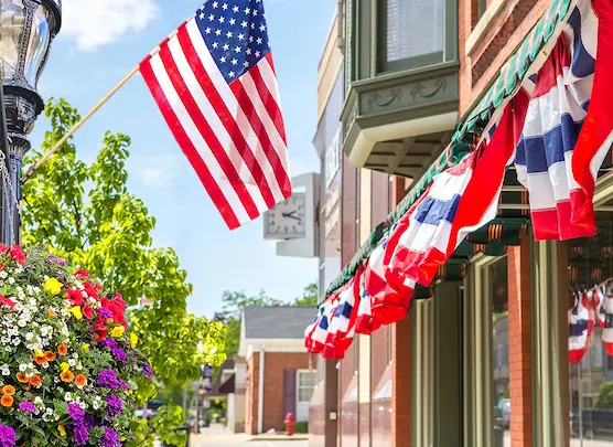 Image of street with businesses celebrating the 4th of July