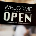 Open sign hanging on a business door.