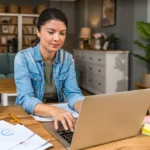 woman at computer creating IRS ready chart of accounts