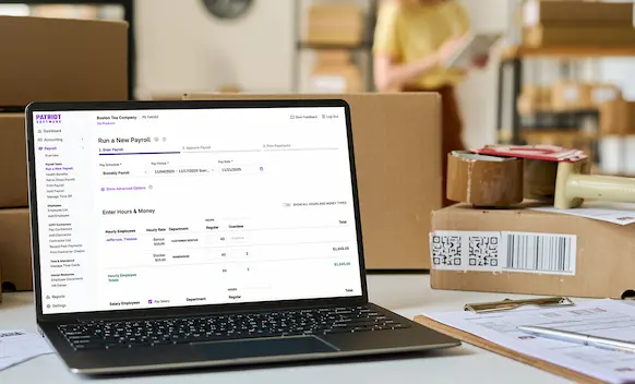 Laptop being used to run payroll.