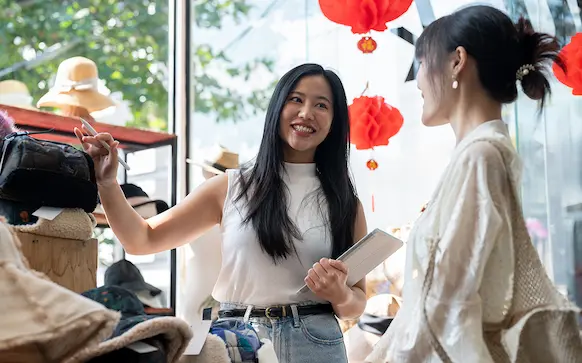 New York business owner taking care of customer