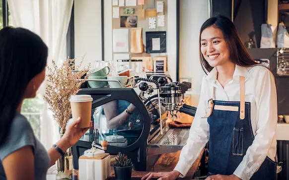 Washington business owner taking care of customer
