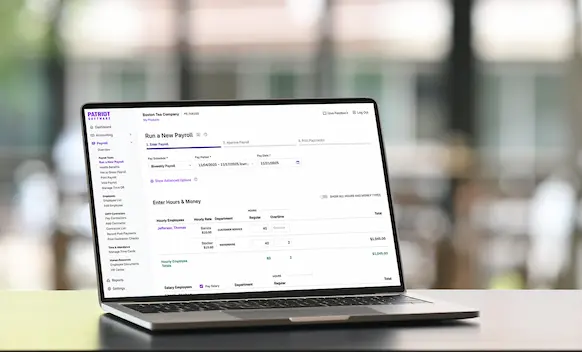 Laptop being used to run payroll.