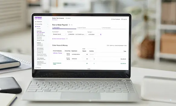 Laptop being used to run payroll.