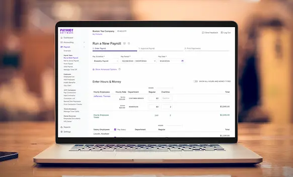 Laptop being used to run payroll.