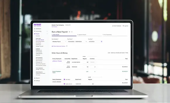 Laptop being used to run payroll.