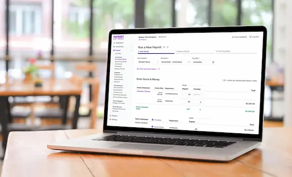 Laptop being used to run payroll.