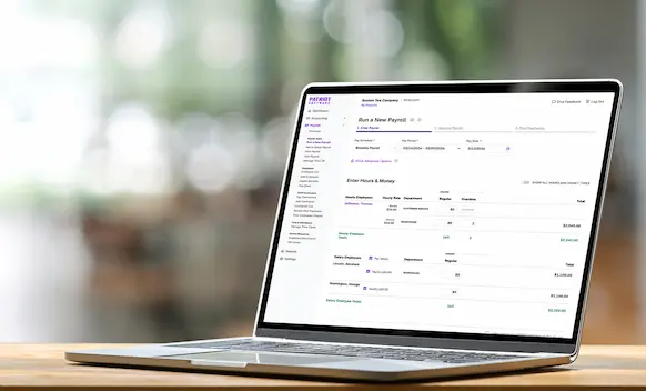 Laptop being used to run payroll.