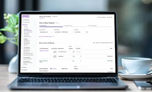 Laptop being used to run payroll.