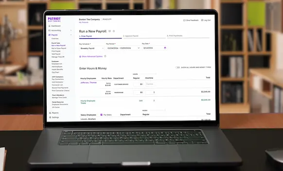 Laptop being used to run payroll.