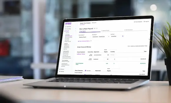 Laptop being used to run payroll.