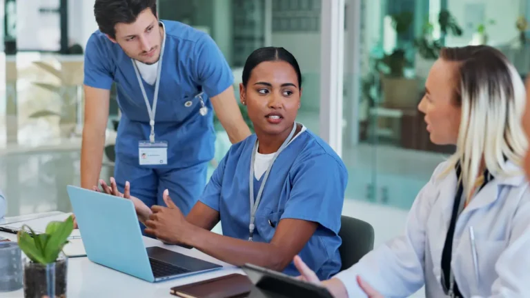 Team of healthcare professionals discuss shift scheduling.