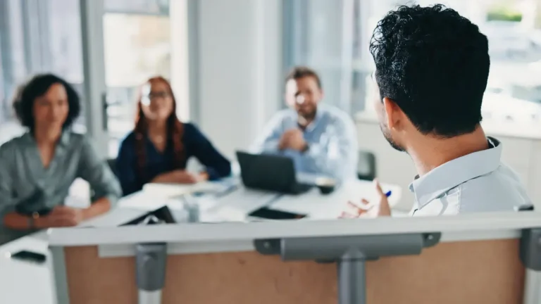 Owner performing a break-even analysis with team.