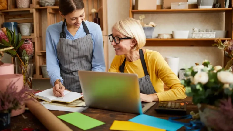 Business owners working together on financial metrics.