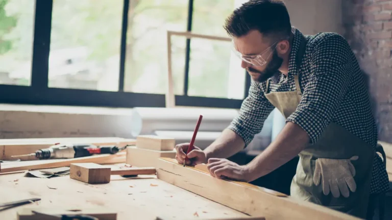 Small business owner woodworking.