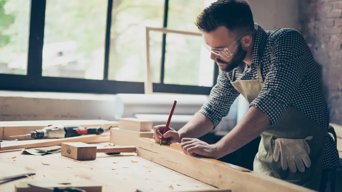 Small business owner woodworking.