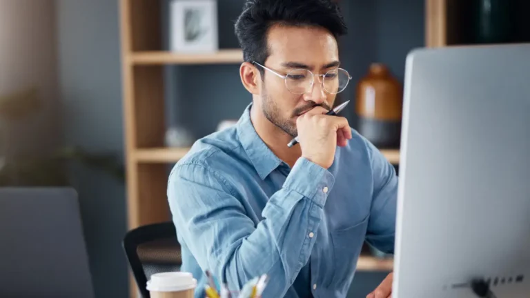 Man learning about the hidden costs of desktop payroll software