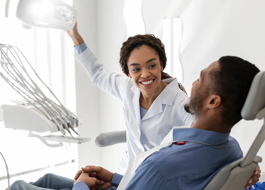 Denist examining patient