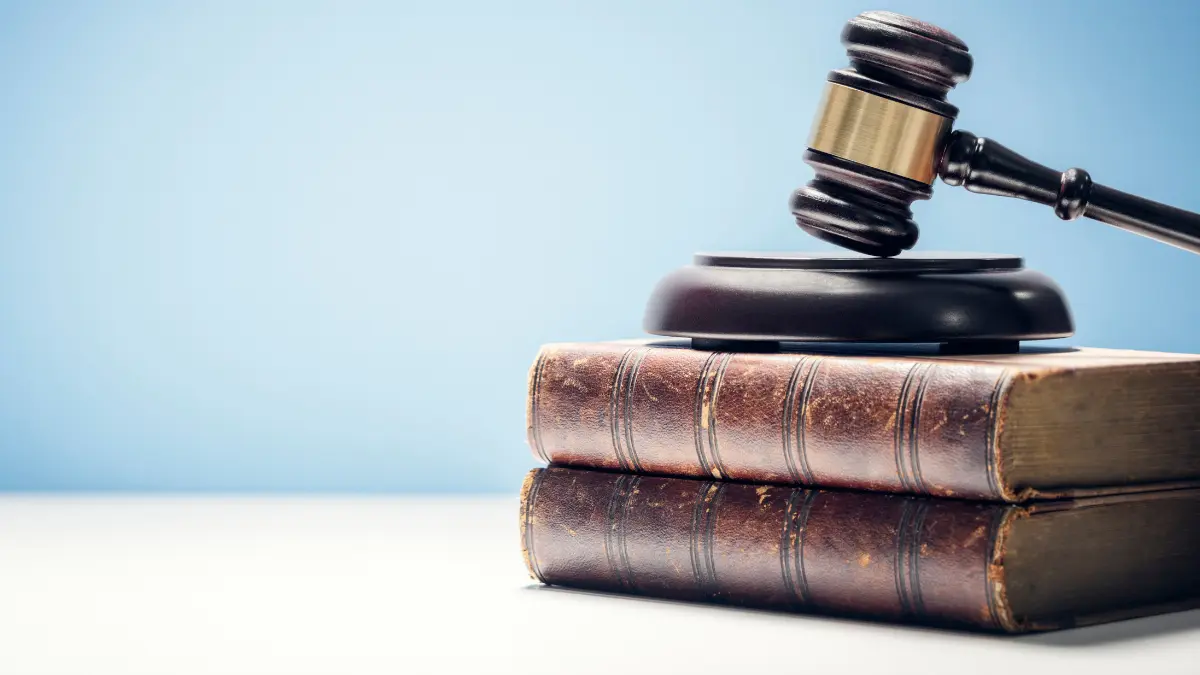 Gavel on a stack of books.