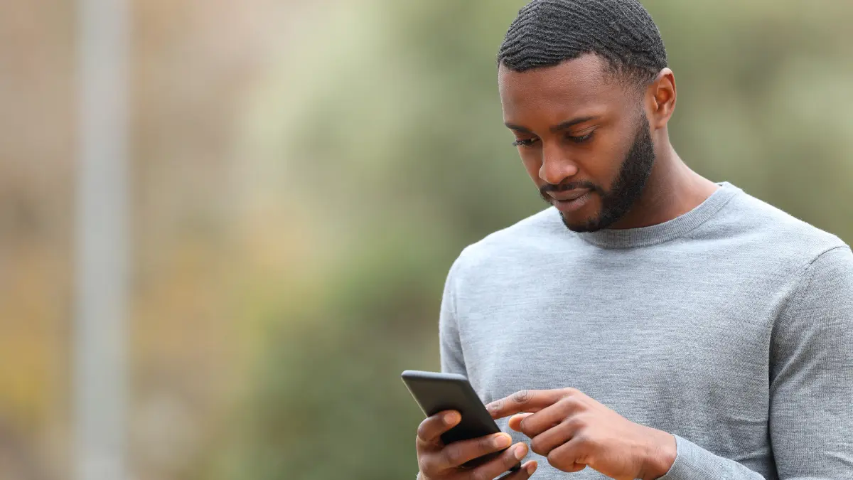 Man on phone shopping for transparent payroll.